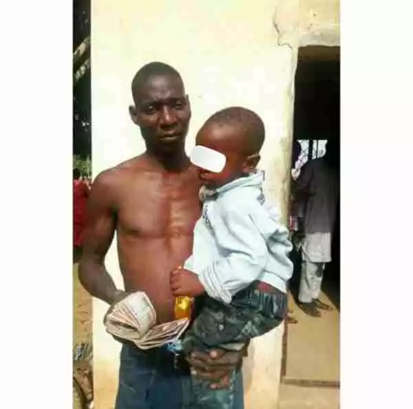 Man Pictured With Money & The Child He Sold For N75k